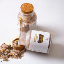 Load image into Gallery viewer, two bottles of bath tea packaging with white labels and herbs like rose, pink Himalayan salt, and oils.
